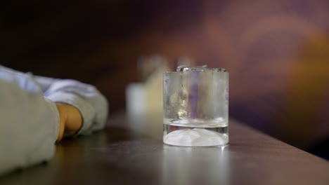 bartender serving whisky