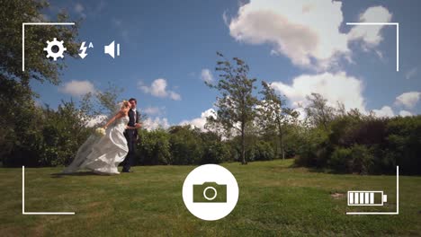 taking photos of a bride and groom on a digital camera