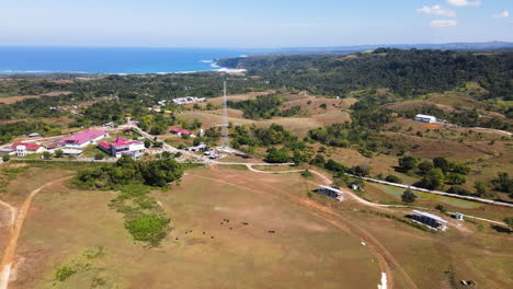 buildings over coastal mountains in the countryside of sumba island, east nusa tenggara, indonesia