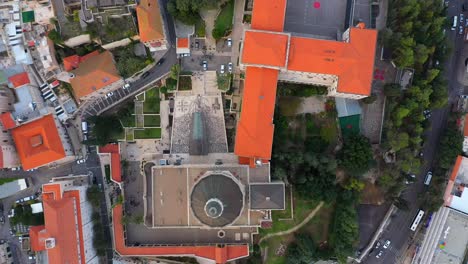 aerial footage of the basilica of the annunciation over the old city houses of nazareth