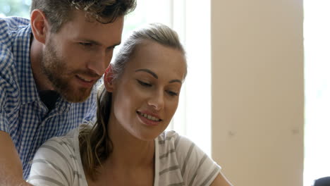 a couple is using tablet computer