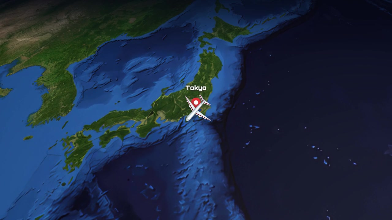 Satellite view animation follows a commercial airplane flying from Atlanta across the globe to Tokyo