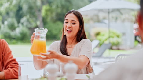 family, pouring and juice at table with happy