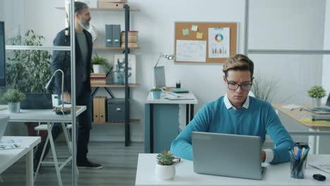 coworkers in an open office setting