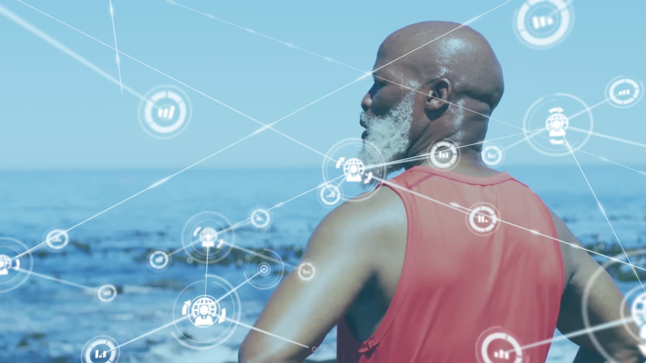 Animation of network of connections over senior african american man standing at beach