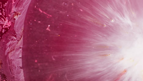 magenta color ink getting mixed in liquid with textured background