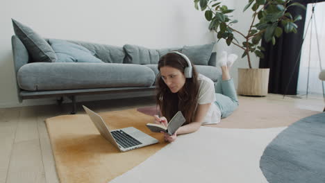 cute young female makes a video call with her laptop at home 2