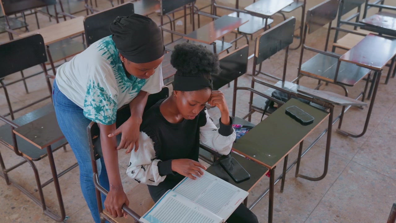 Mother supports anxious student attentively. Focused study session with nurturing teacher guidance. Peaceful study setting where educator comforts nervous learner through critical exam processes