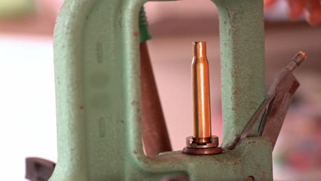 Closeup-of-reloading-press-while-inserting-primer-into-bottom-of-cartridge
