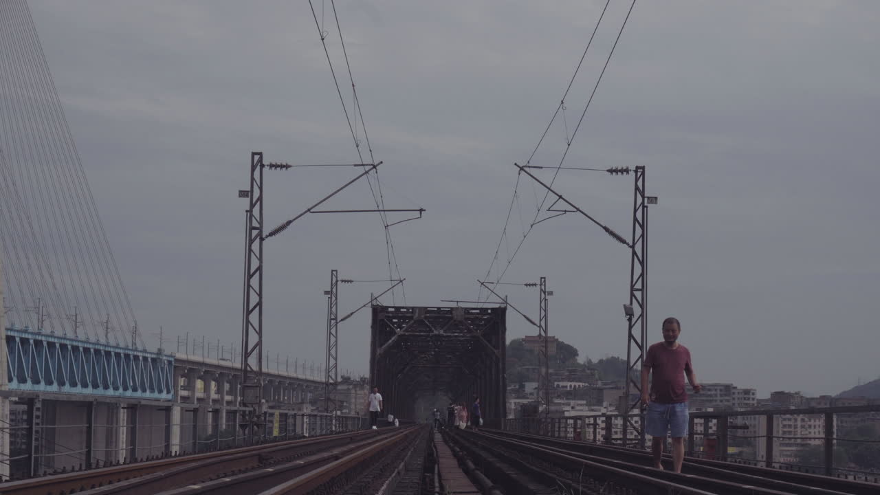 Summer man walking on Railway Bridge
