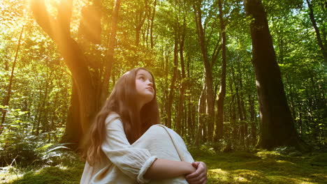 girl in a sunlit forest