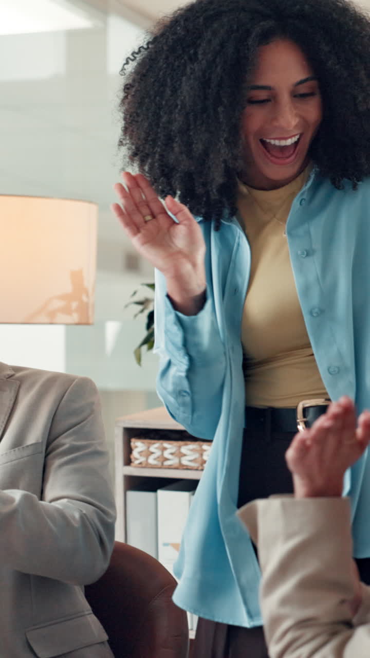 Happy Business Team Clapping and Celebrating Success in Office