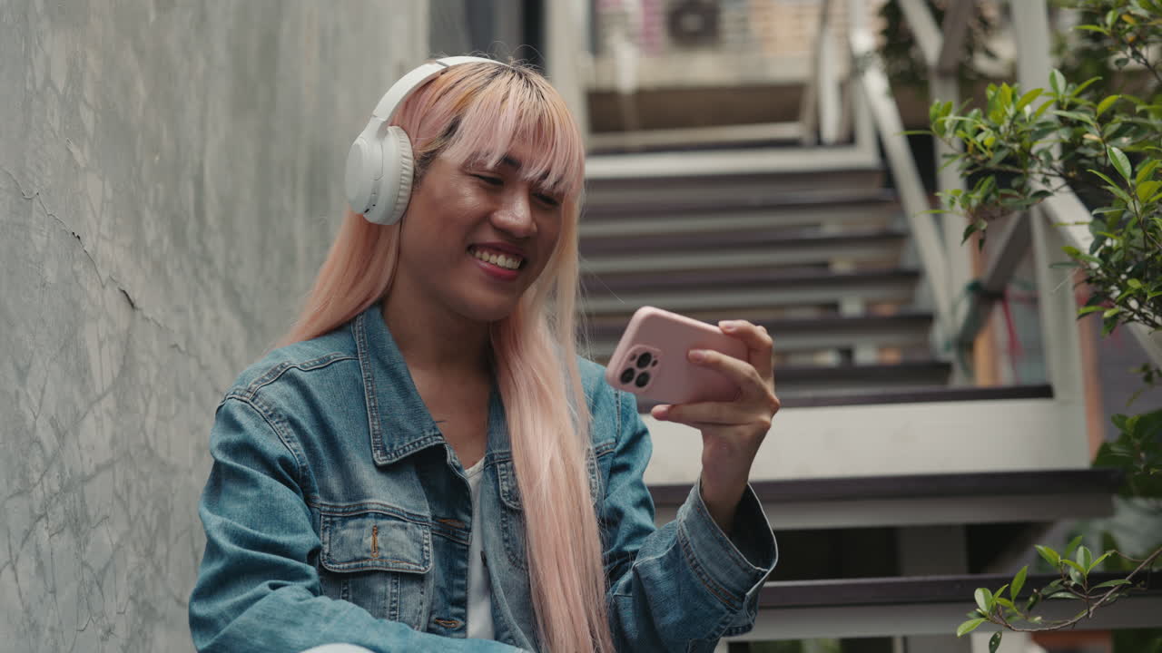 Woman on stairs video chatting