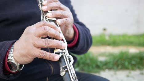 person playing a clarinet