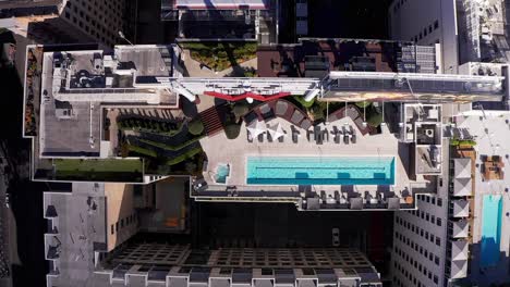 aerial bird's eye shot of a luxury rooftop pool