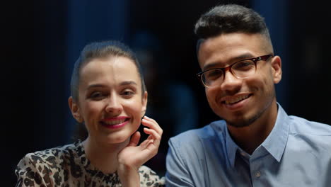 Waiter-hands-taking-picture-on-smartphone-of-businessman-and-businesswoman