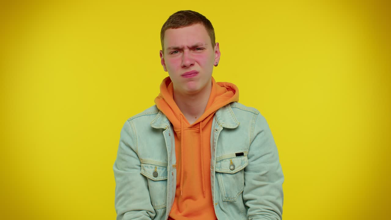 Displeased upset man dissatisfied with bad quality, wave hand, shake head, dismiss awful idea