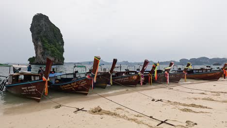 boats docked on a scenic thai beach