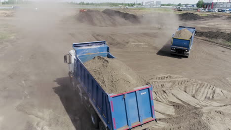 construction site with dump trucks