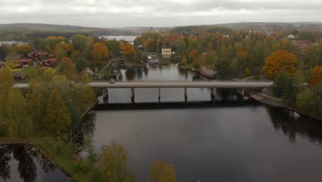 Cars-and-trucks-driving-over-a-bridge-on-a-cloudy-autumn-day