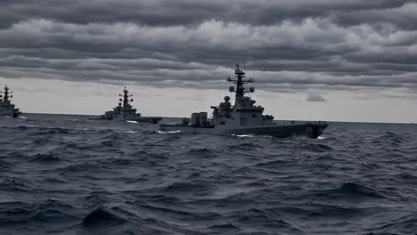 dramatic naval scene with warships on a stormy sea, captured from a low-angle, evoking a tense