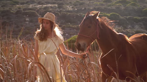 pretty woman walking with a horse