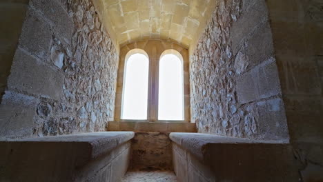 ancient stone room with arched windows in chlemoutsi castle museum kastro greece