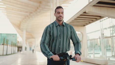 young man riding a scooter outdoors.