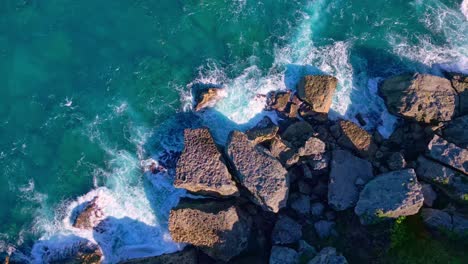 Foamy-Ocean-Waves-Splashing-On-Rocks-In-A-Beach-In-Cabo-Frances-Viejo,-Maria-Trinidad-Sanchez,-Dominican-Republic---aerial-top-down