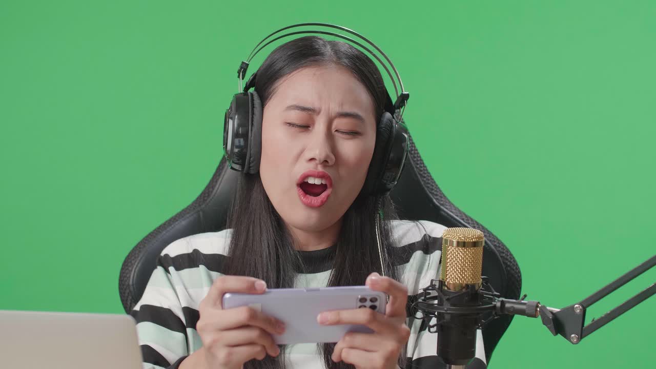 Woman playing a mobile game, streaming