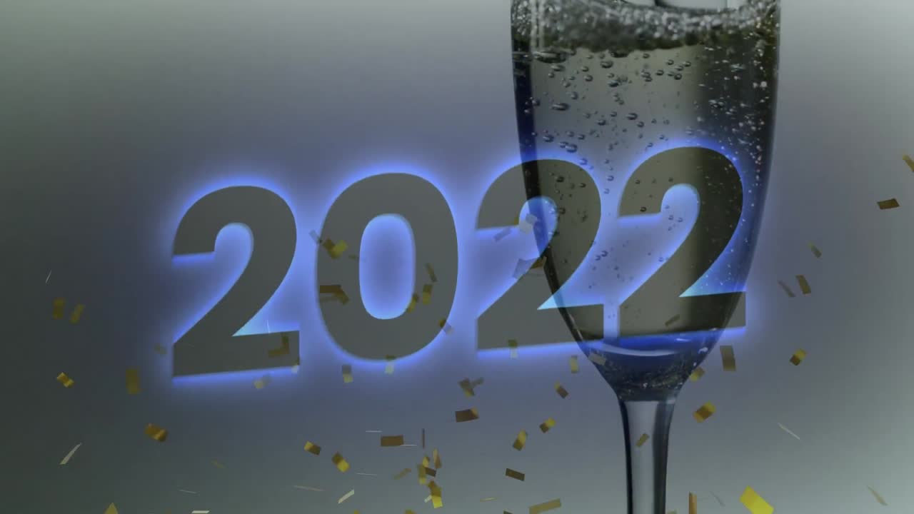 animación del texto de 2022 sobre confeti y una copa de champán