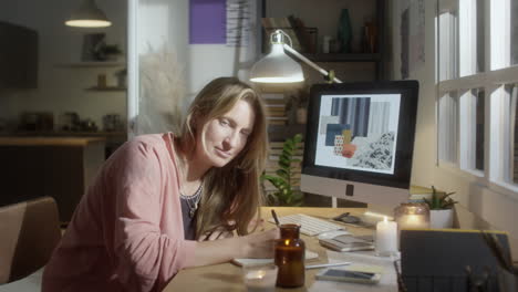 portrait of female designer in cozy home office