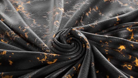 close-up of dark gray fabric with gold pattern