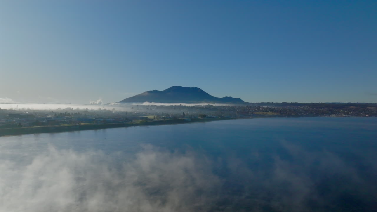 Misty Morning Lake with Mountain View