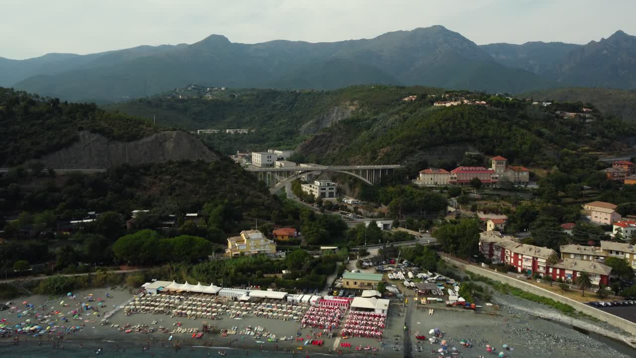 Aerial View of Town with Bridge and Mountains