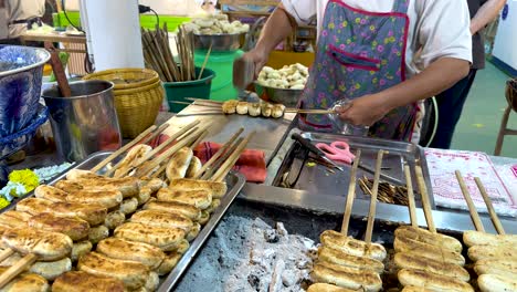 vendor grilling bananas at a bustling market