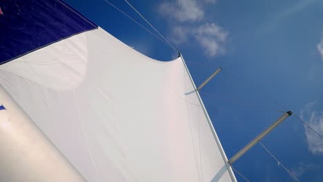 close-up view of the sails against cloudy blue sky