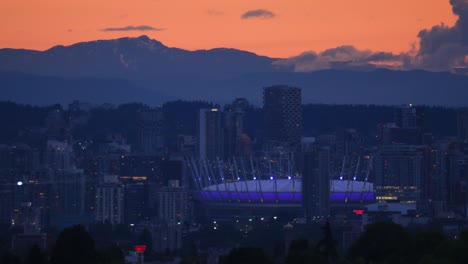 Sunset-Over-Mountains-And-BC-Place-Stadium-In-Vancouver,-British-Columbia,-Canada