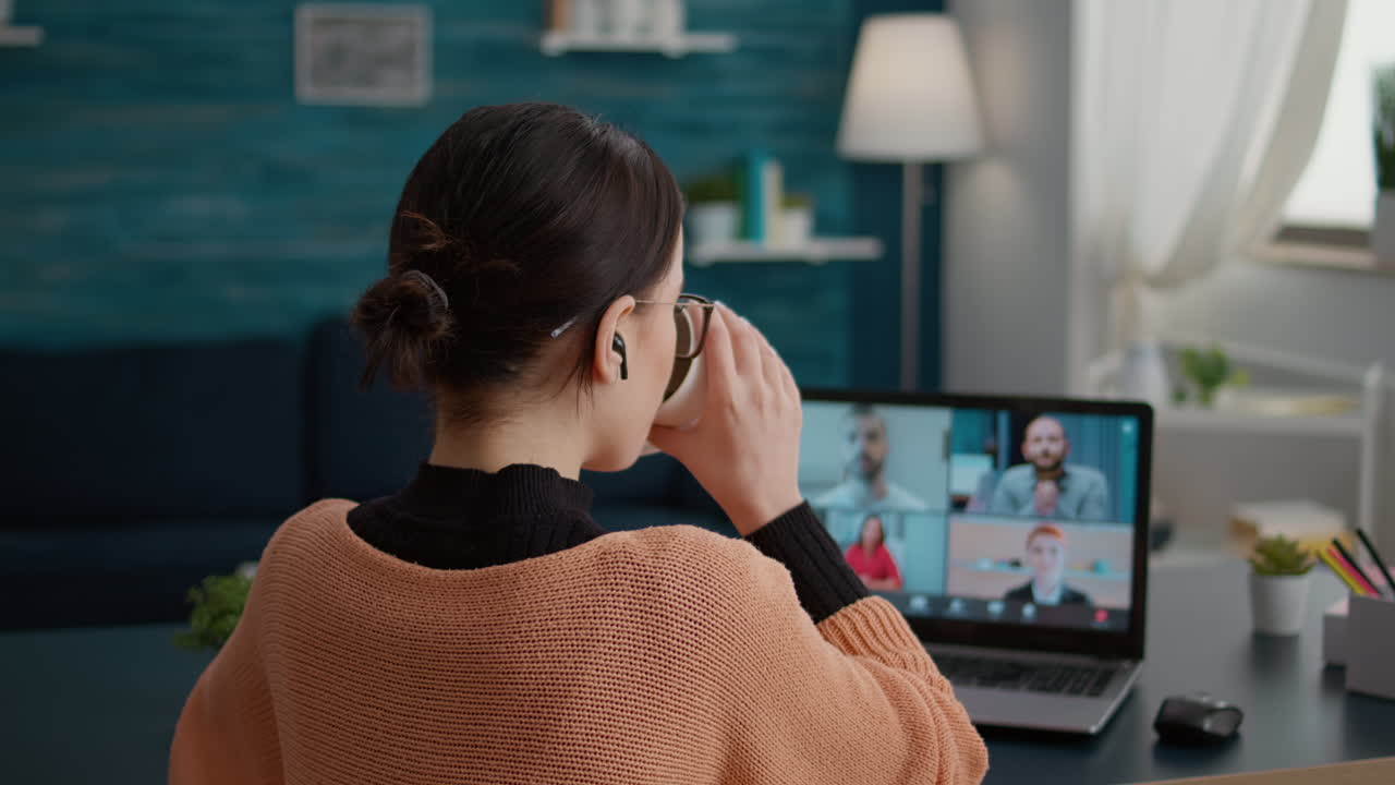 Female student talking on online class video call to study