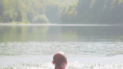 person splashing in a lake