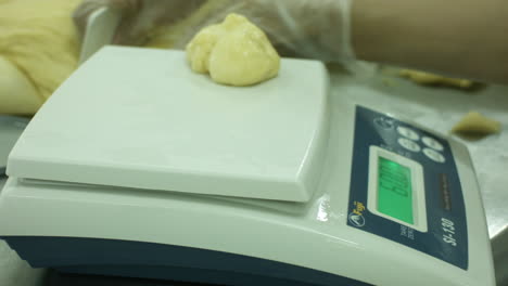 slicing and weighing bread dough