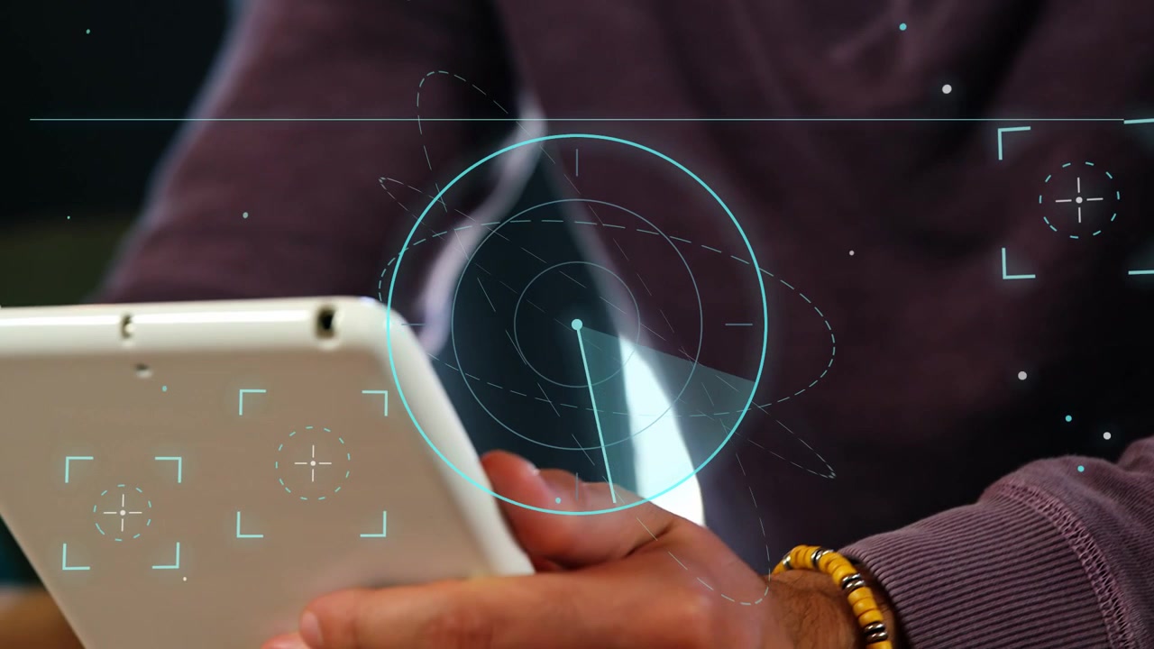 Man leaning raising tablet at table and tapping after radar sweep, animating tech data for analysis
