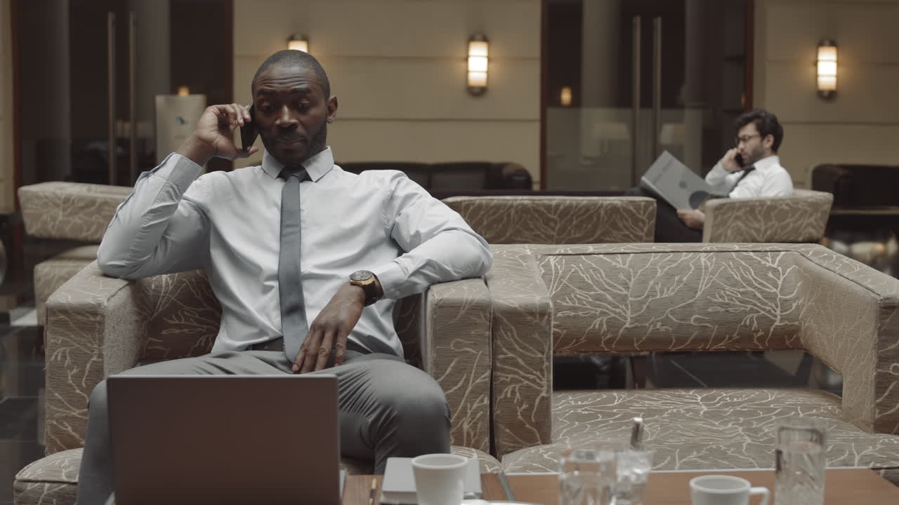Entrepreneur Talking on Phone in Restaurant