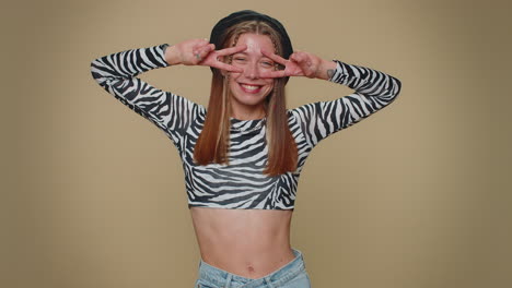 lovely happy woman showing victory sign, hoping for success and win, doing peace gesture, smiling