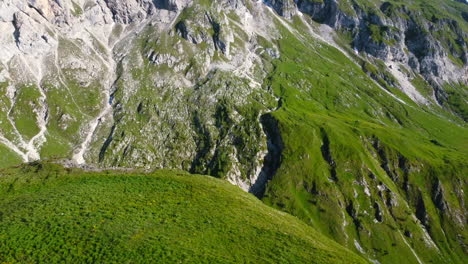 beautiful aerial landscape of lush green mountain valley in the dolomites of italian alps at sunset