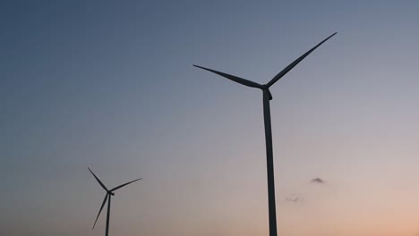 Wind-Turbines-Silhouette-against-the-Blue-sky-during-Sunset,-clean-alternative-energy-in-Thailand-and-mainland-Southeast-Asia