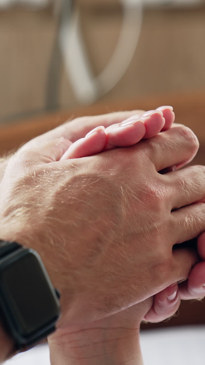 Pregnant woman supporting in hospital. Husband helping his lady. Vertical video