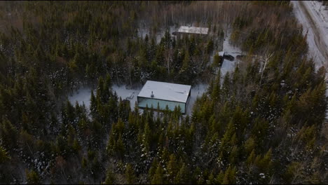 Thicket-Woods-With-Reflexion-Chalet-Mirror-In-Charlevoix,-Quebec-Canada