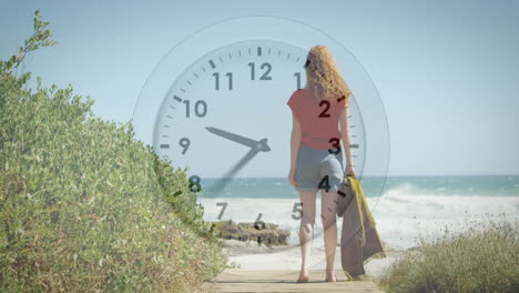 animation of moving clock over caucasian woman at beach