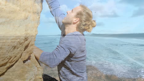 animation of landscape over caucasian male hiker climbing